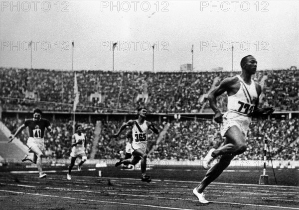 Jesse Owens running at the 1936 Olympics in Berlin.