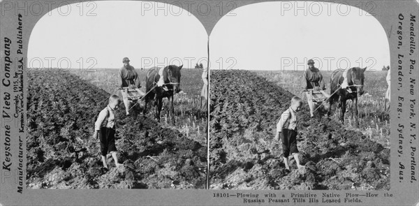 Russian farmers with a primitive native plough, c.1900