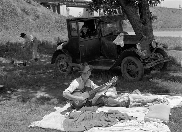 Camp of migrant workers near Prague, Oklahoma. Lincoln County by Russell Lee, 1903-1986, dated 19390101.