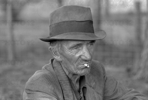 Migrant worker resting along roadside