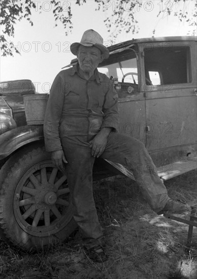 Migrant worker camped along band of Arkansas River