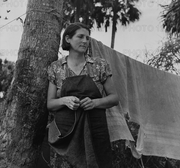 Wife of packinghouse worker, migrant from Missouri said We have never lived like hogs before but we sure does now, it's no different from hog livvin. Canal Point, Florida 19390101.