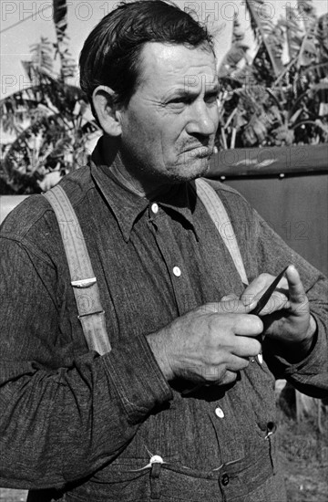 7A migrant fruit worker in Belle Glade, Florida. He was formerly a tenant farmer in George 19370101