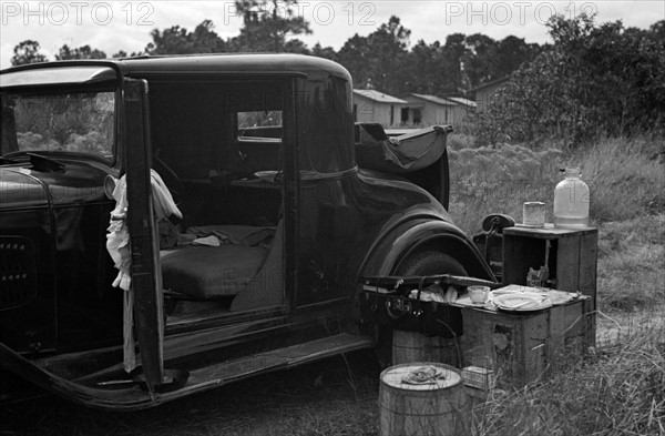 Car used by migrant agricultural workers; the rear has been fixed up as a bed, near Winter Haven, Florida 19370101.