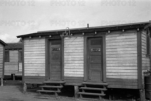 Toilets in the tourist camp for migrant agricultural workers near Belle Glade, Florida 19370101