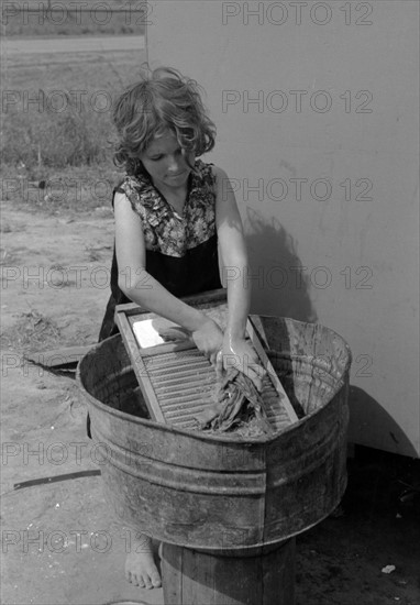 Twelve-year-old girl who keeps house in a trailer for her three brothers who are migrant workers, 19390101