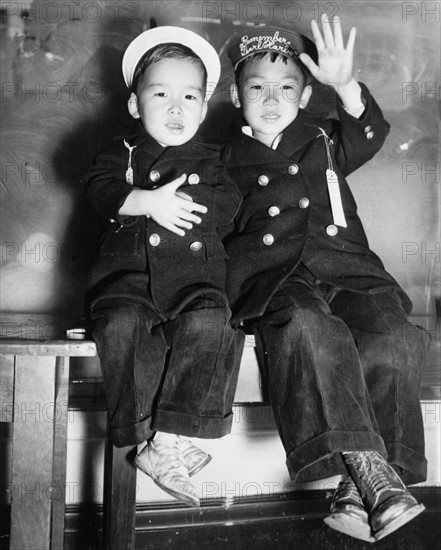 Photograph of the evacuation of two Japanese boys from San Francisco as a result of the Pearl Harbour attacks