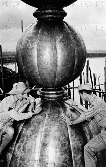 Photograph of Corporal Anthony J. Scopelliti, and Private First Class John C. Byron, Jr. on top the Taj Mahal dome