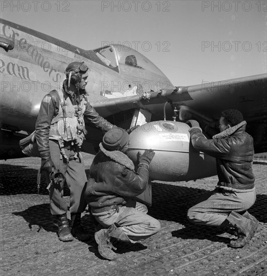Photograph of Edward C. Gleed and two unidentified Tuskegee airmen, Ramitelli, Italy