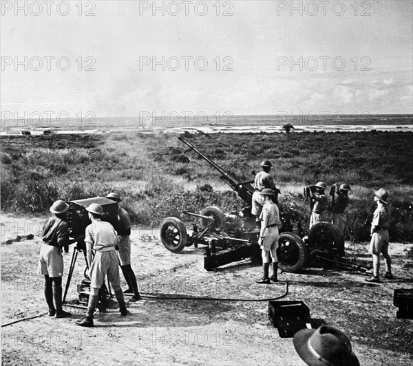 Photographic print of Bofors gun firing during target practice