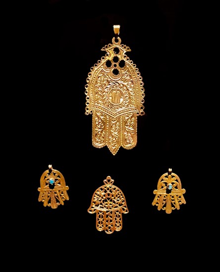 Gold palm shaped amulet, known as, the Hamsa throughout the Middle East and Africa