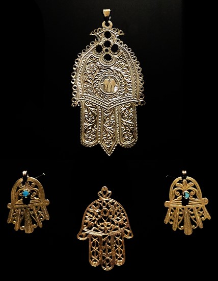 Gold palm shaped amulet, known as, the Hamsa throughout the Middle East and Africa