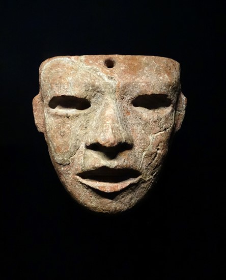 Greenstone mask of a mythical dignitary ancestor, or captive from Mexico