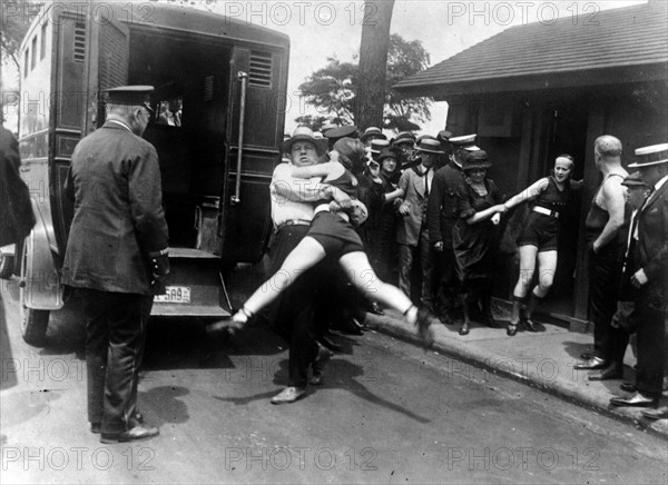 Two women being arrested for wearing inappropriate bathing costumers, USA