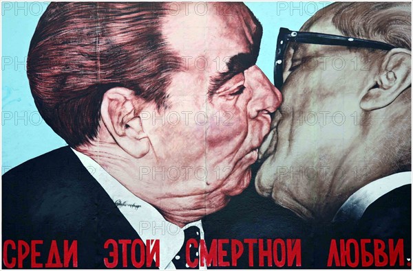 Soviet leader leonid Brezhnev kissing East German leader Honecker