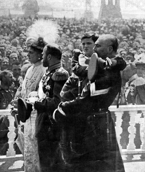 Photographic print of The last Emperor of Russia Nicholas II with his wife Empress Alexandra and their son Alexei, being held by a Cossack