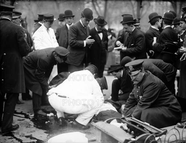 Surgeons and police working over Silverstein at anarchist riot, Union Square, New York.