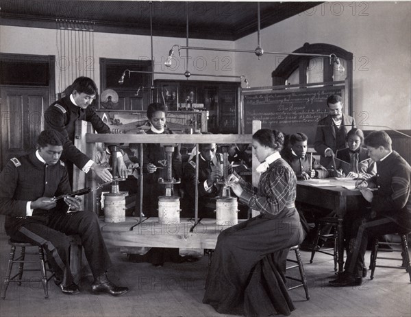 The cheese press screw - students studying agricultural sciences, Hampton Institute, Hampton, Virginia. 1900