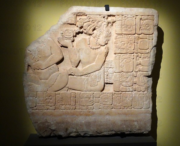 A Mayan frieze shows an offering of incense is being presented to a serpent spirit