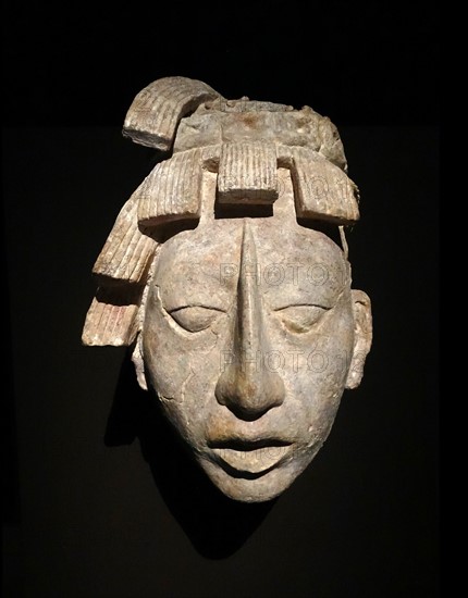 Mayan stucco head of a youth. From a funerary chamber