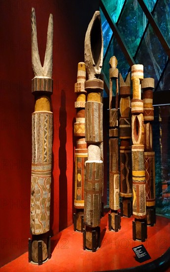 painted wooden, tribal funerary posts, made by the Tiwi people of Bathurst Island, Australia.