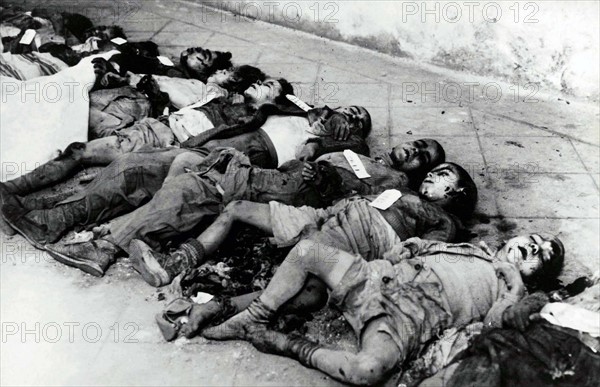 On a street in Barcelona are the bodies of some young children