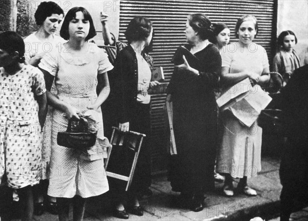 Women queue for basic food supplies in Spain, during the Spanish Civil War