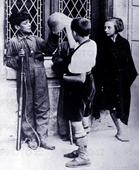 Children play like soldiers, during the Spanish Civil War