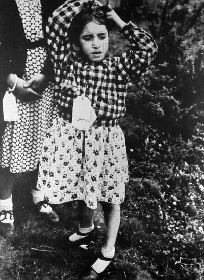 A Spanish Civil War, child refugee, arrives in England 1938