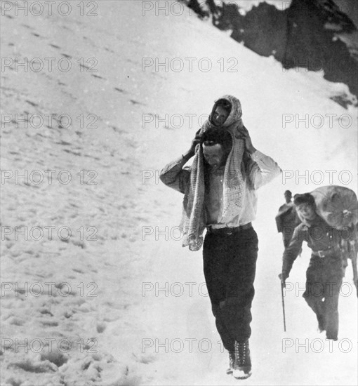 Refugees cross snow covered mountains, during the Spanish Civil War