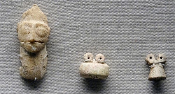 Sumerian stone head and eye figurines made of glazed faience and clay. From the Eye Temple, Tell Brak, Syria