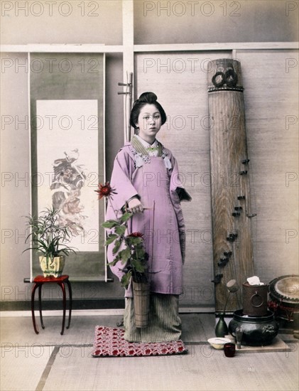 Photograph shows a portrait of a young woman