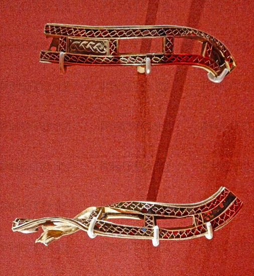 Anglo Saxon metalwork; 5th-6th Century AD. Slotted strips, with cloisonné garnets