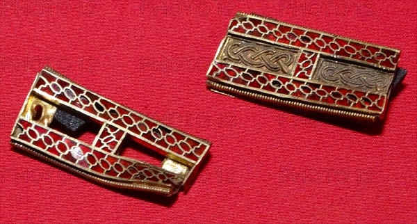 Anglo Saxon metalwork; 5th-6th Century AD. Slotted strips, with cloisonné garnets