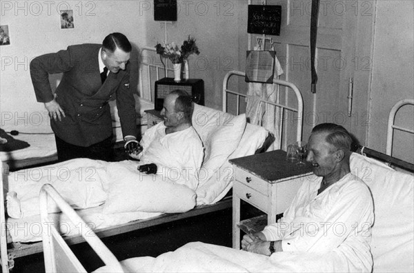 German Chancellor Adolf Hitler visits war wounded in a military hospital 1941