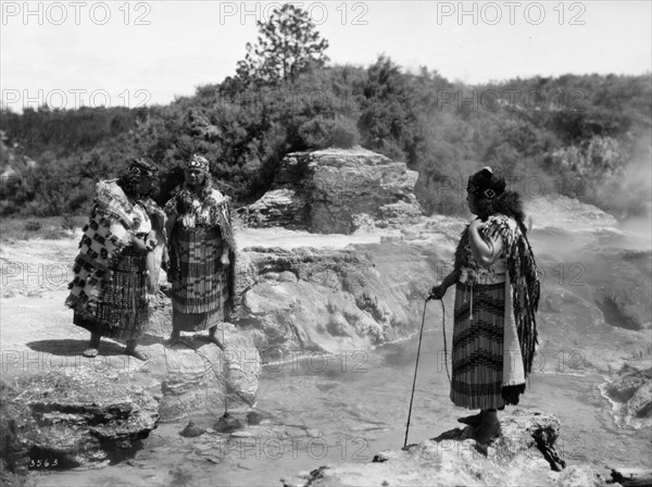 Maori cooking at boiling geo-thermal pool, Rotorua, New Zealand circa 1950