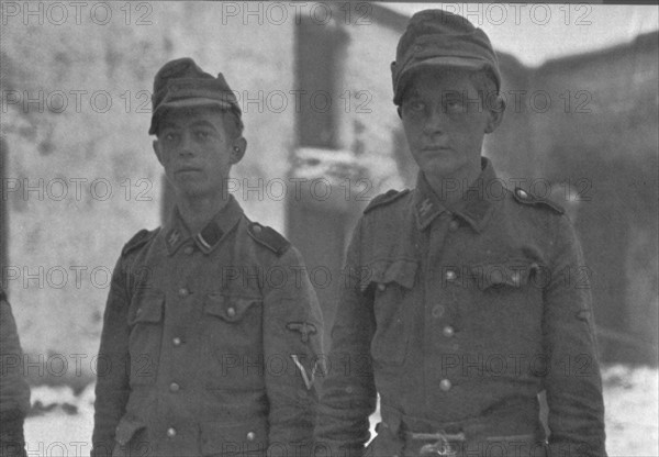 Photograph of two Hitler Youth members surrending to Allied forces