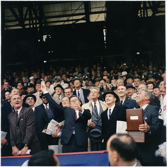 Colour photograph of President J F Kennedy throwing the first ball on opening day of the 1961 Baseball season