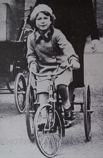 Princess (later Queen Elizabeth II) Elizabeth of Great Britain on a tricycle 1933