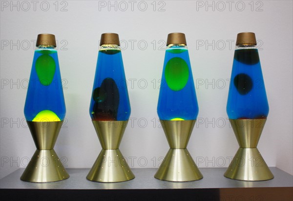 lava lamps contain blobs of coloured wax inside a glass vessel