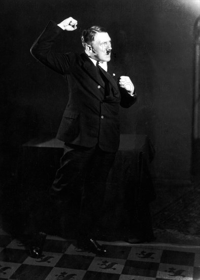 German Nazi leader Adolf Hitler, rehearsing a speech in front of the mirror 1933