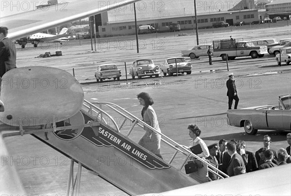 Photograph of the First Lady Jacqueline Kennedy boarding Air Force One