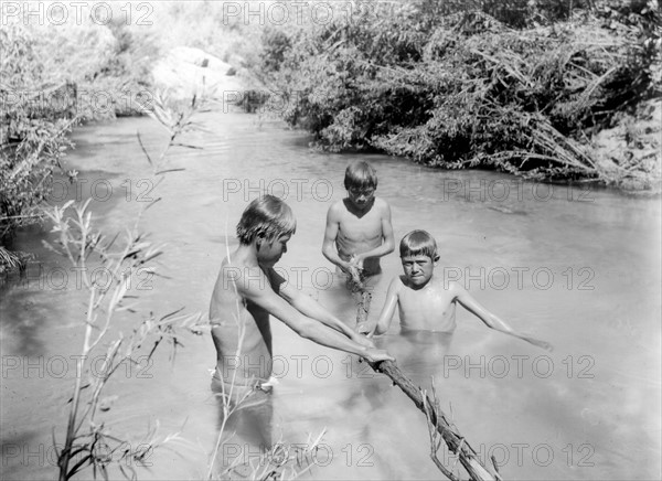 Havasupai Indian boys bathing in the Havasu River, Arizona