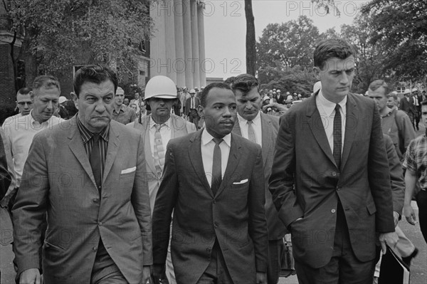 James Meredith (African-American student) walking to class following de-segregation,