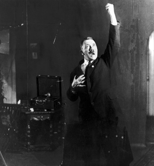 Photograph of Adolf Hitler rehearsing his speech in front of a mirror