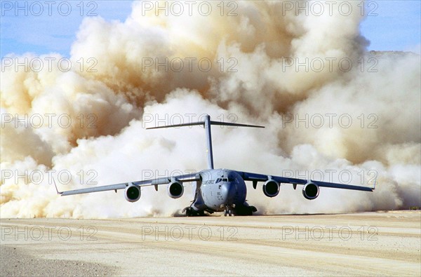 Photograph of the clouds of dust behind US Air Force C-17 Globemaster III at Fort Irwin, California