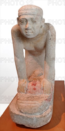 statue of a servant grinding crops. Limestone. Old Kingdom, 5th Dynasty (2465-2323 B.c.)