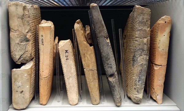 Assyrian cuneiform tablets stored in a museum