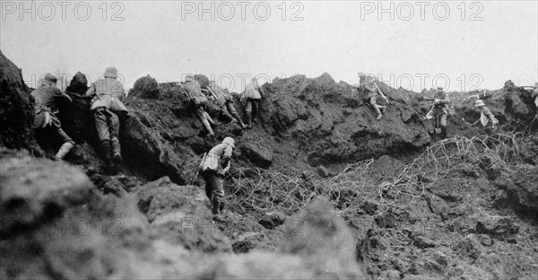 World War One German infantry advance from a trench under allied gunfire. 1915