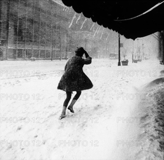 Woman walking in 16 inches of snow in Manhattan